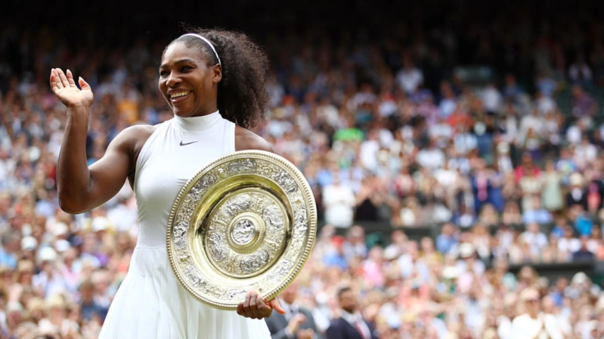 Serena Williams accepting another trophy after winning another grand slam.